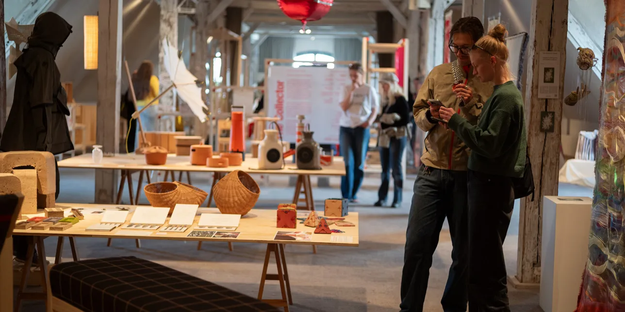 Exhibition hall with visitors. Photo.