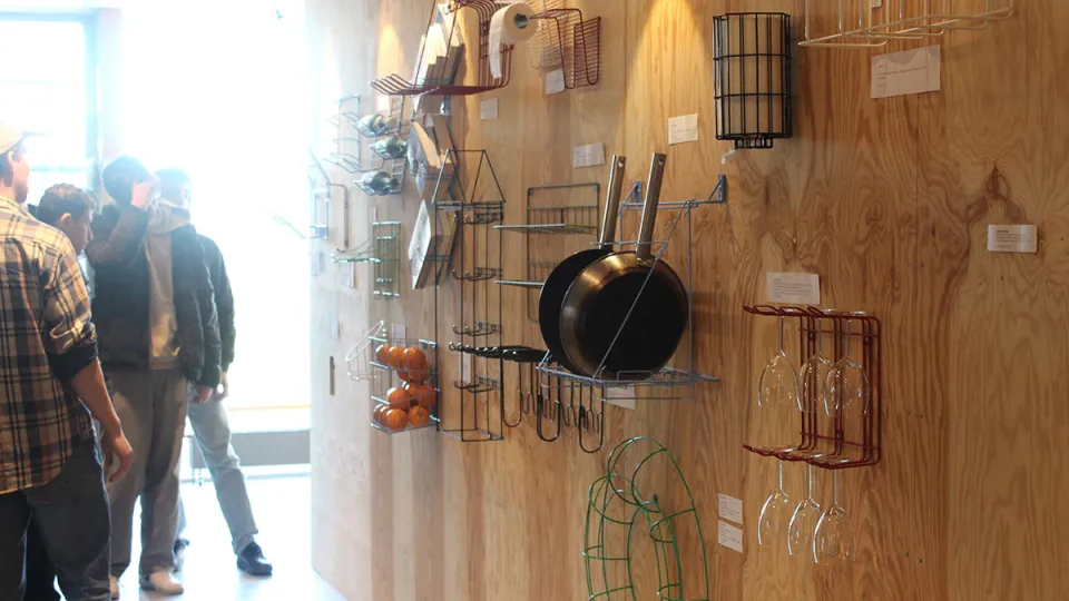 a wall of different wire based storage solutions. Photo. 