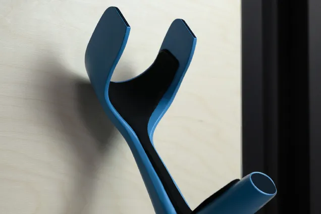 the handle of a crutch, in blue and black. 