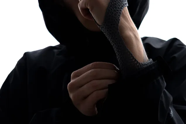 person fastening a splint around their wrist. Photo. 