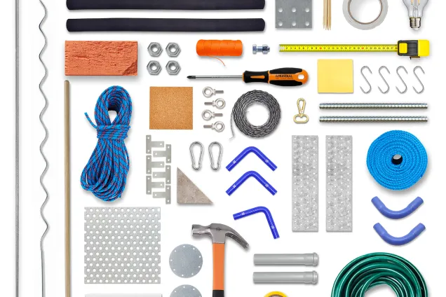 many everyday tools and objects seen from an overhead view.