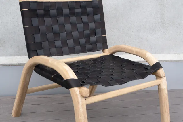a chair with a woven seat and back. 