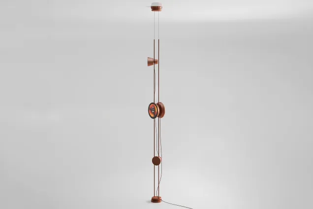 Vertical speaker system in metallic copper finish on a white studio backdrop. 3D-rendering.