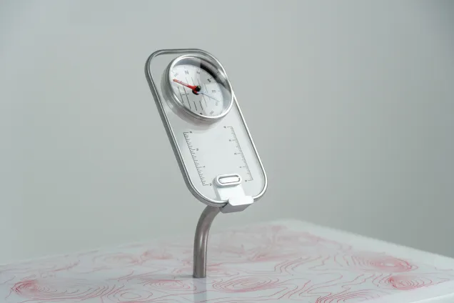 see through compass on a display stand. Photo. 