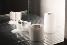partly burned candles showing a metal inside. Photo. 