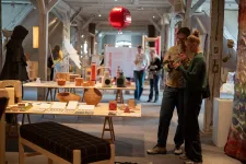 Exhibition hall with visitors. Photo.