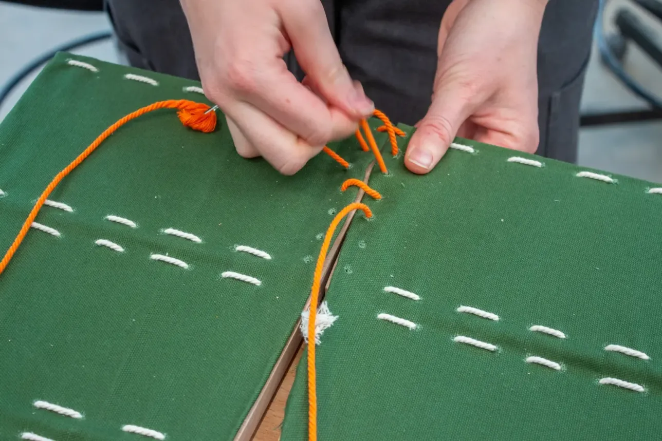 stitching process of a green pouf