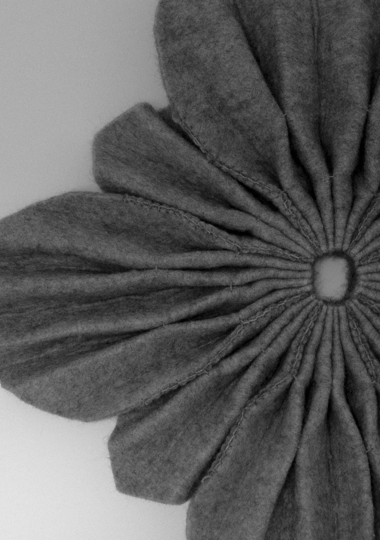 felt fabric folded into the shape of a flower. 