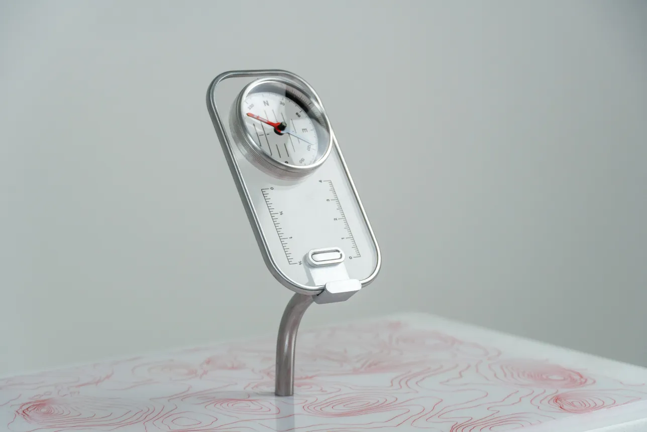 see through compass on a display stand. Photo. 