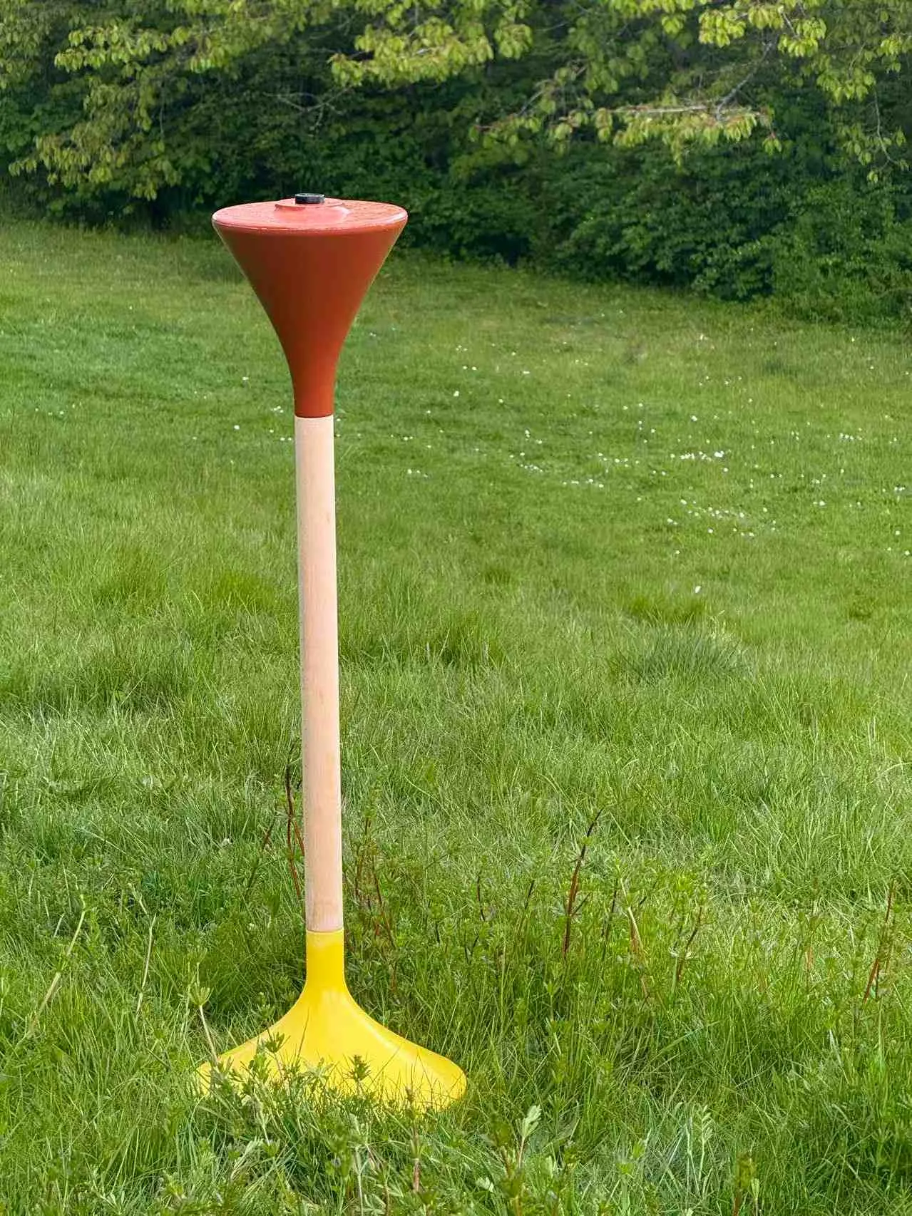 The product stands on the grass. Photo.