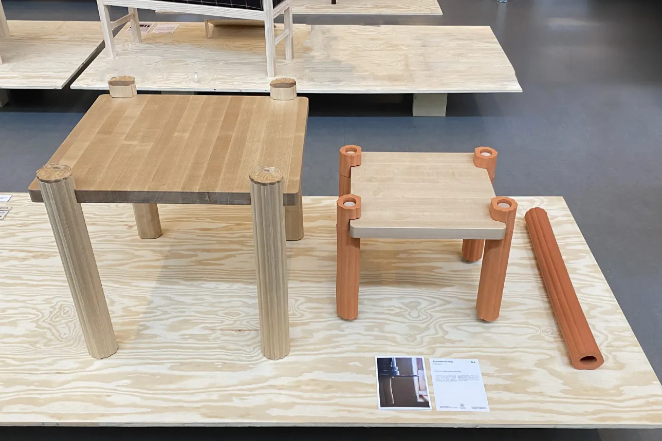 Two tables with clay legs in terracotta and white. Photo. 