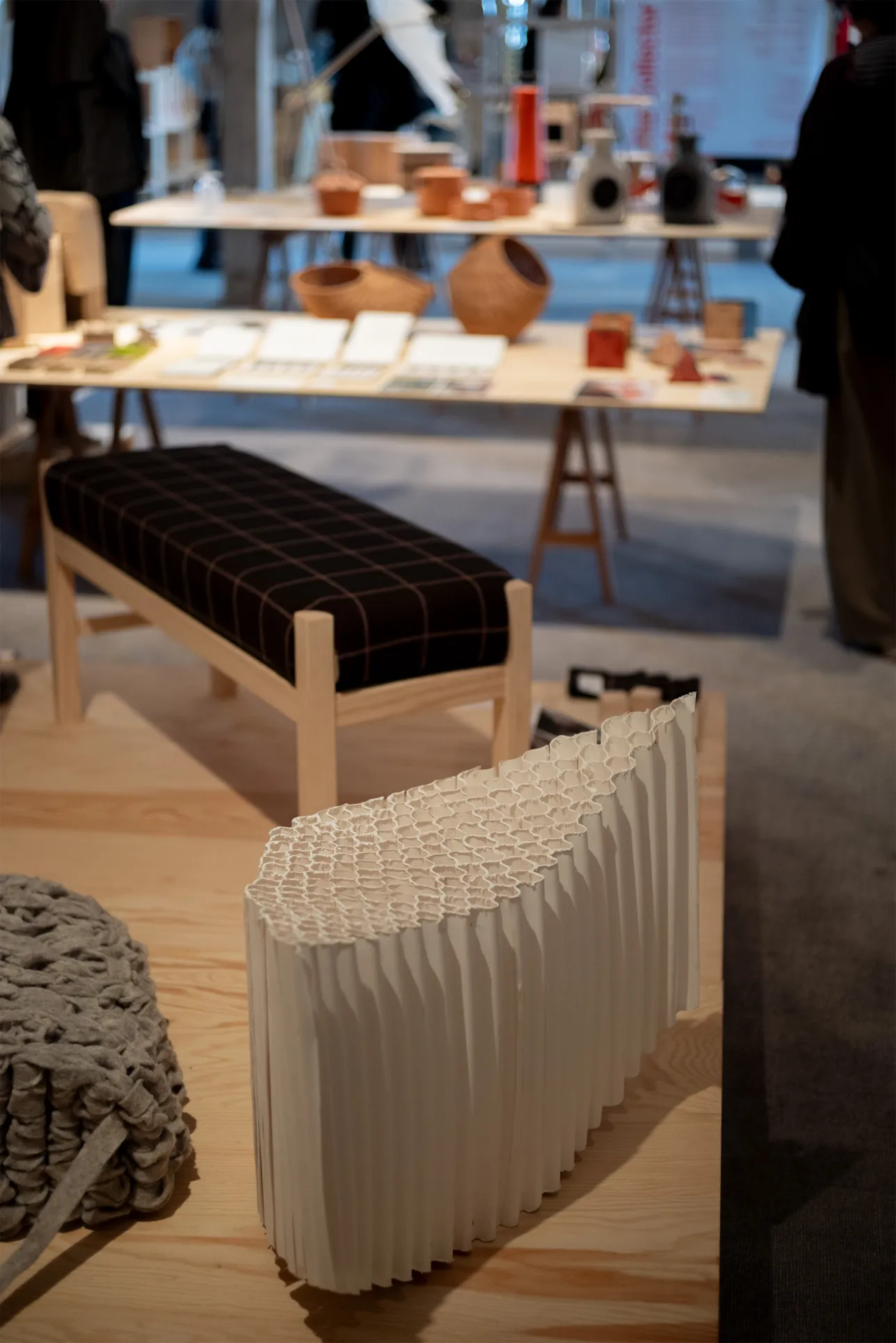 Different seating designs in the foreground of the exhibition area. Photo. 